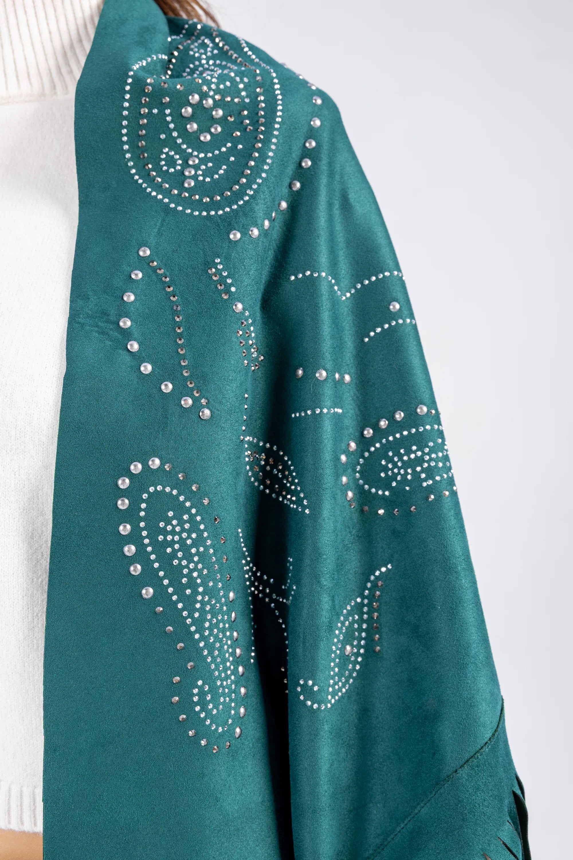 Teal scarf with decorative patterns and embellishments on a white background