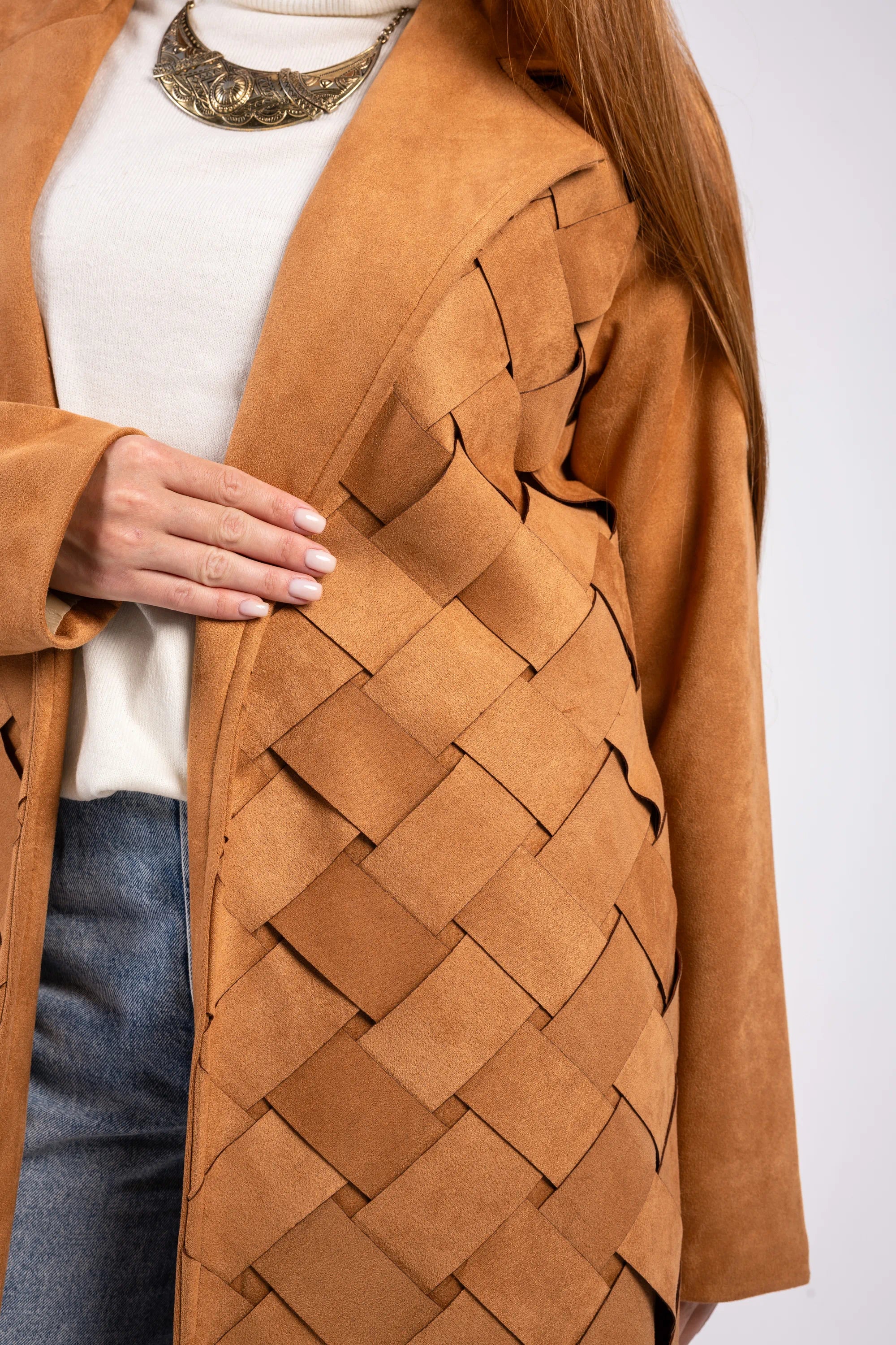 Brown woven coat worn by a person on a white background