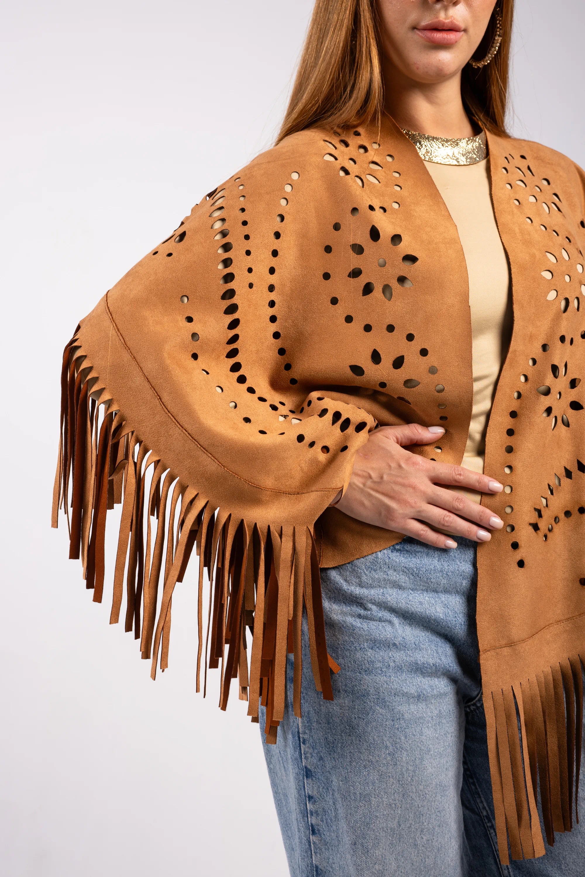Brown suede fringe jacket worn by a person on a white background