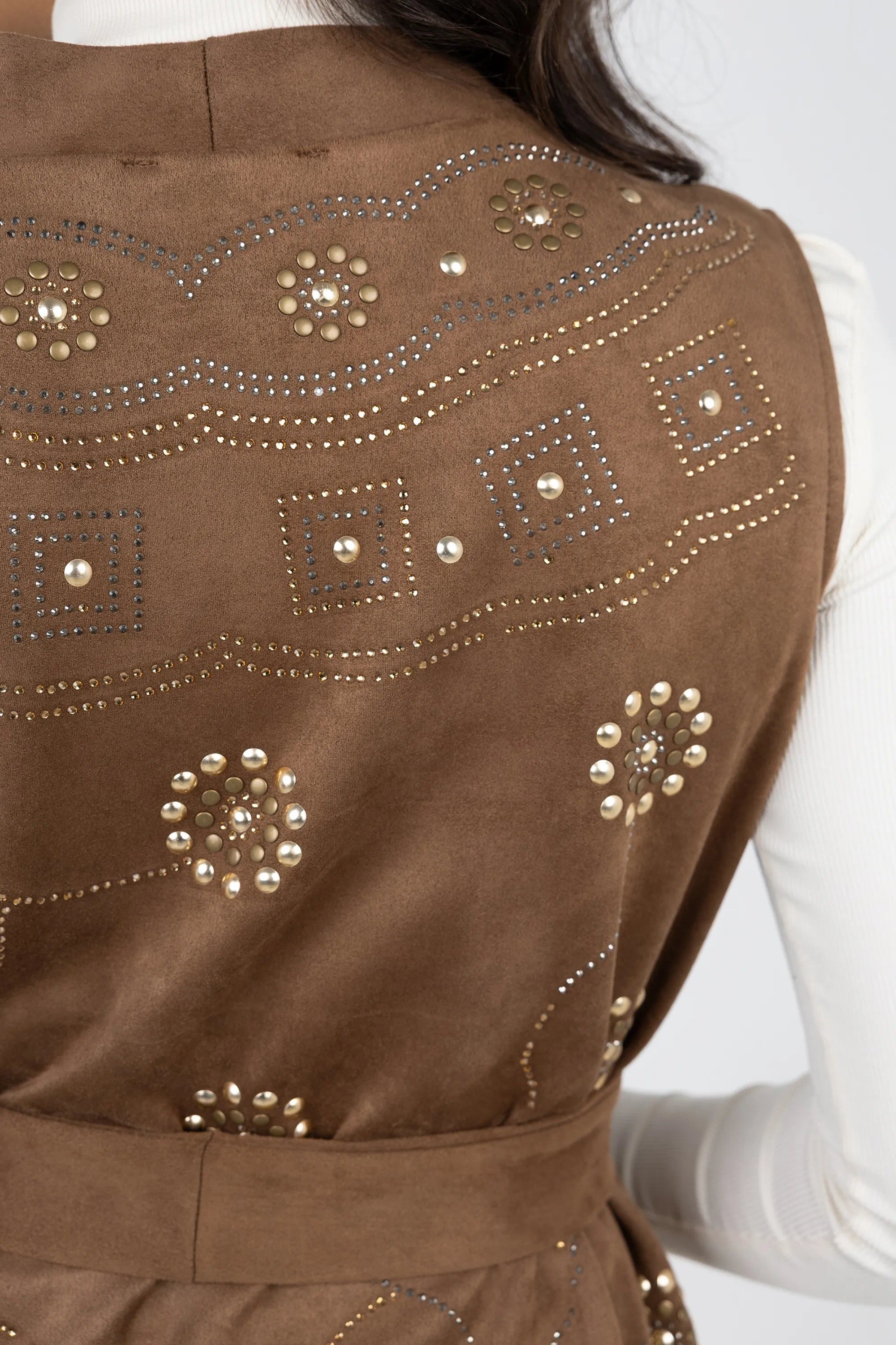 Brown vest with decorative studs on a white background