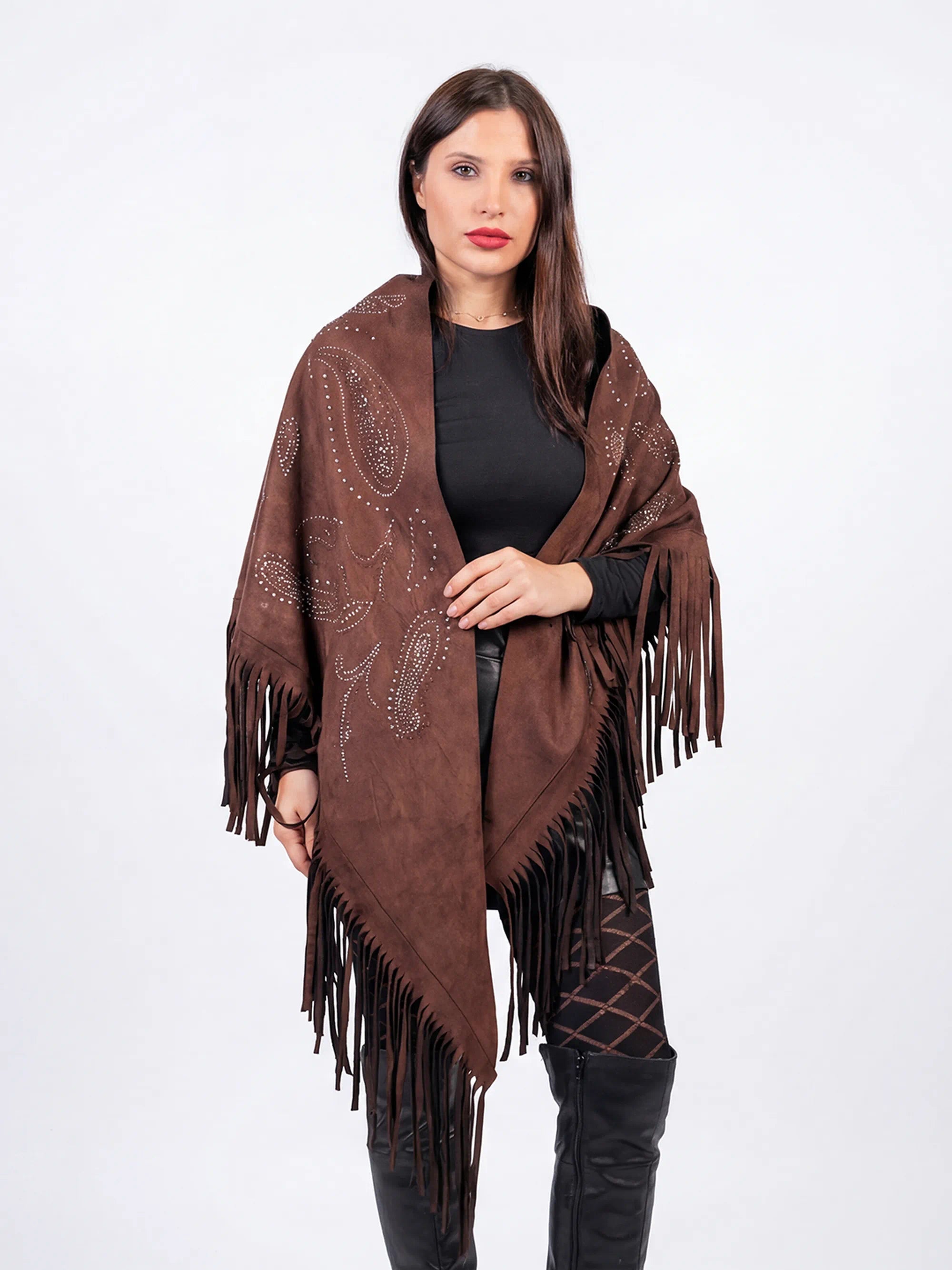 Woman wearing a brown patterned shawl with fringes on a white background