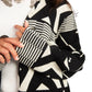 Black and white patterned sweater with geometric design