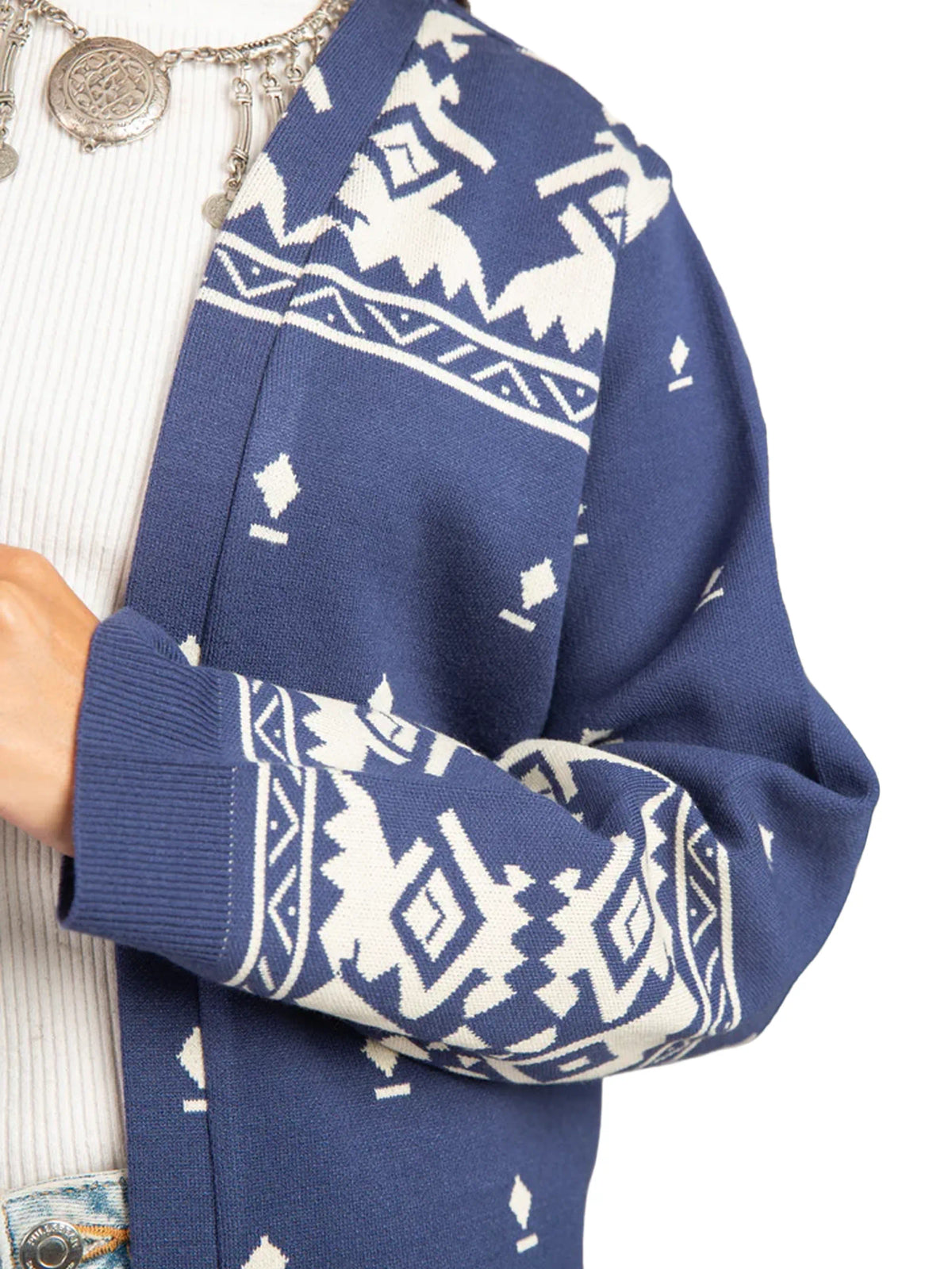 Navy blue sweater with white geometric pattern on a white background