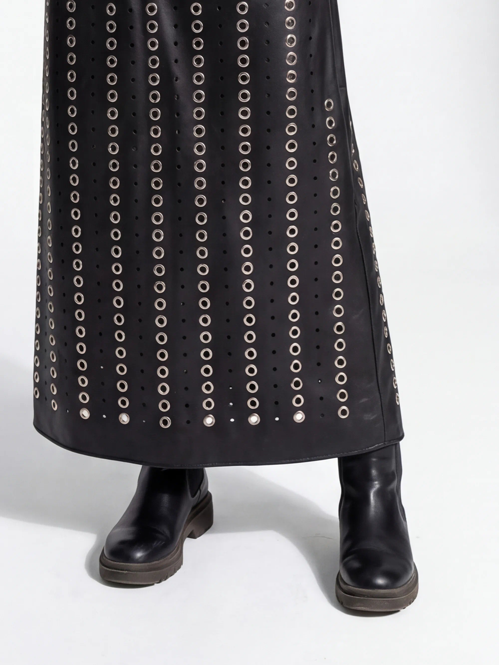 Black studded skirt with a plain background
