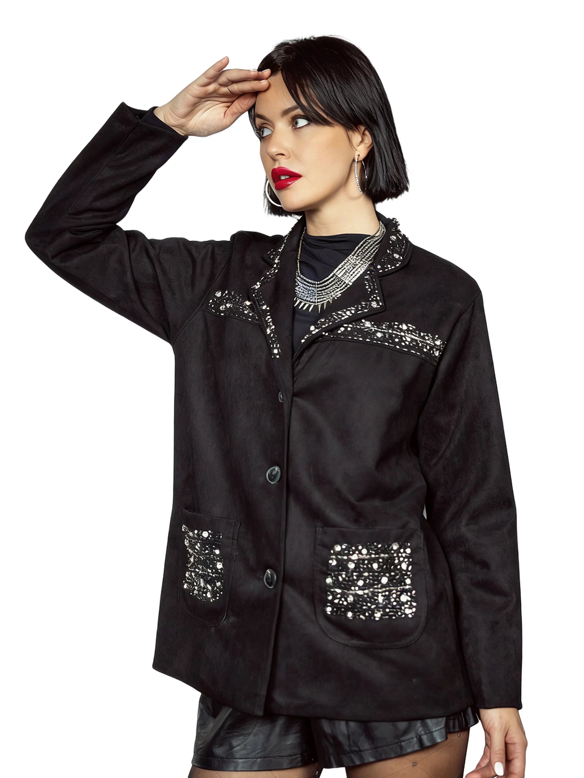 Woman wearing a black jacket with decorative patterns on a white background