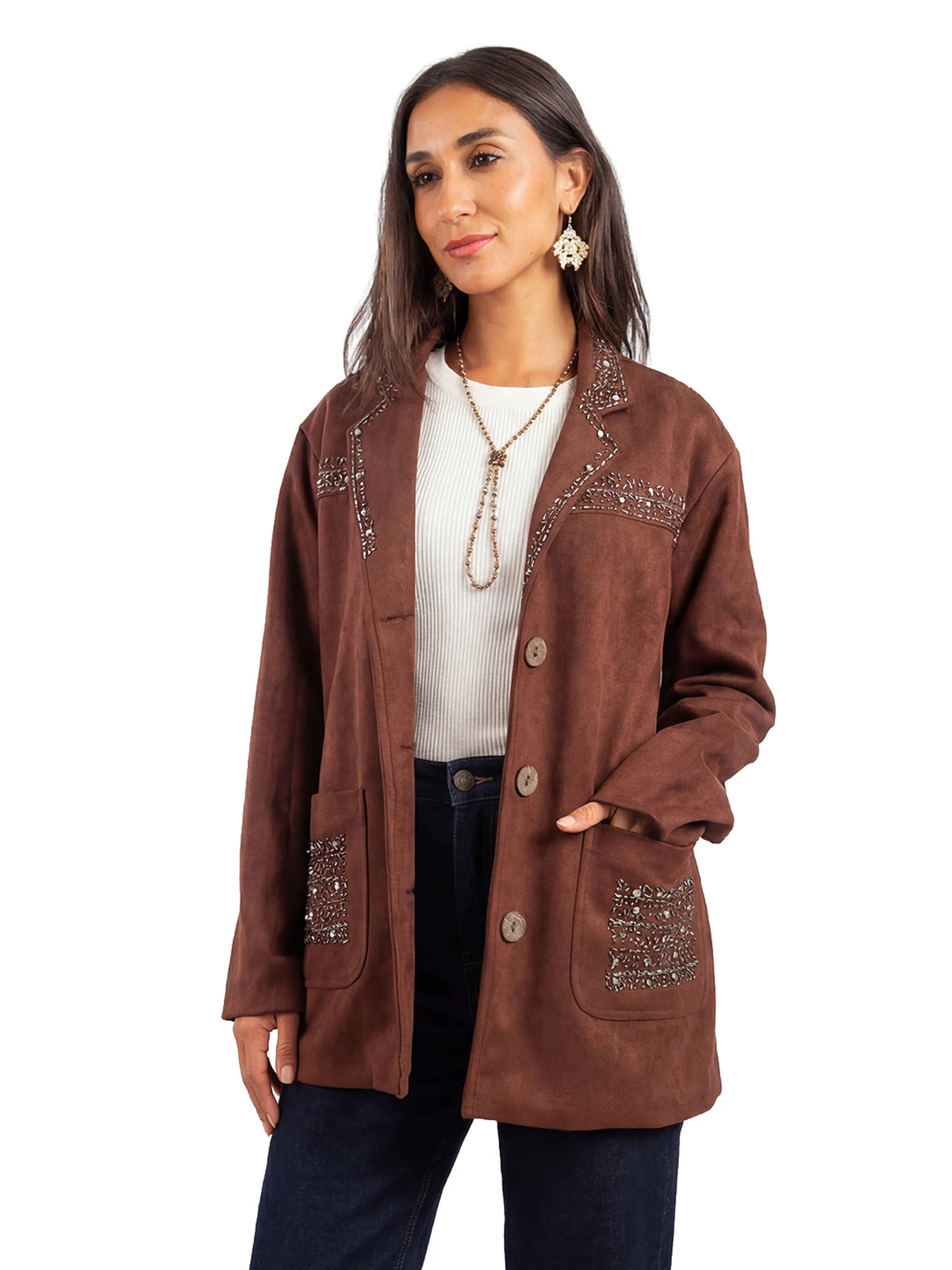 Woman wearing a brown jacket with embellishments on a white background