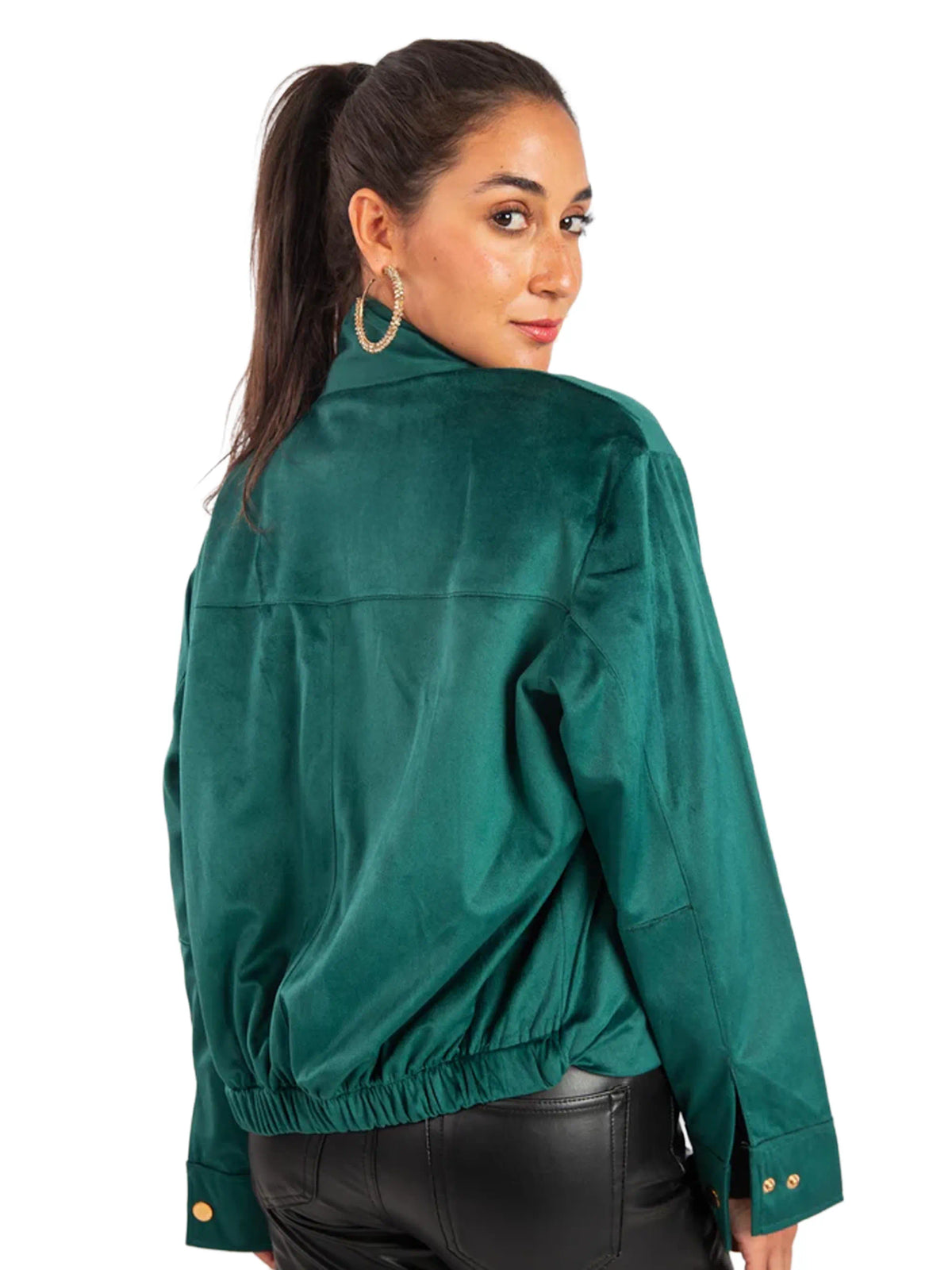 Woman wearing a green jacket on a white background