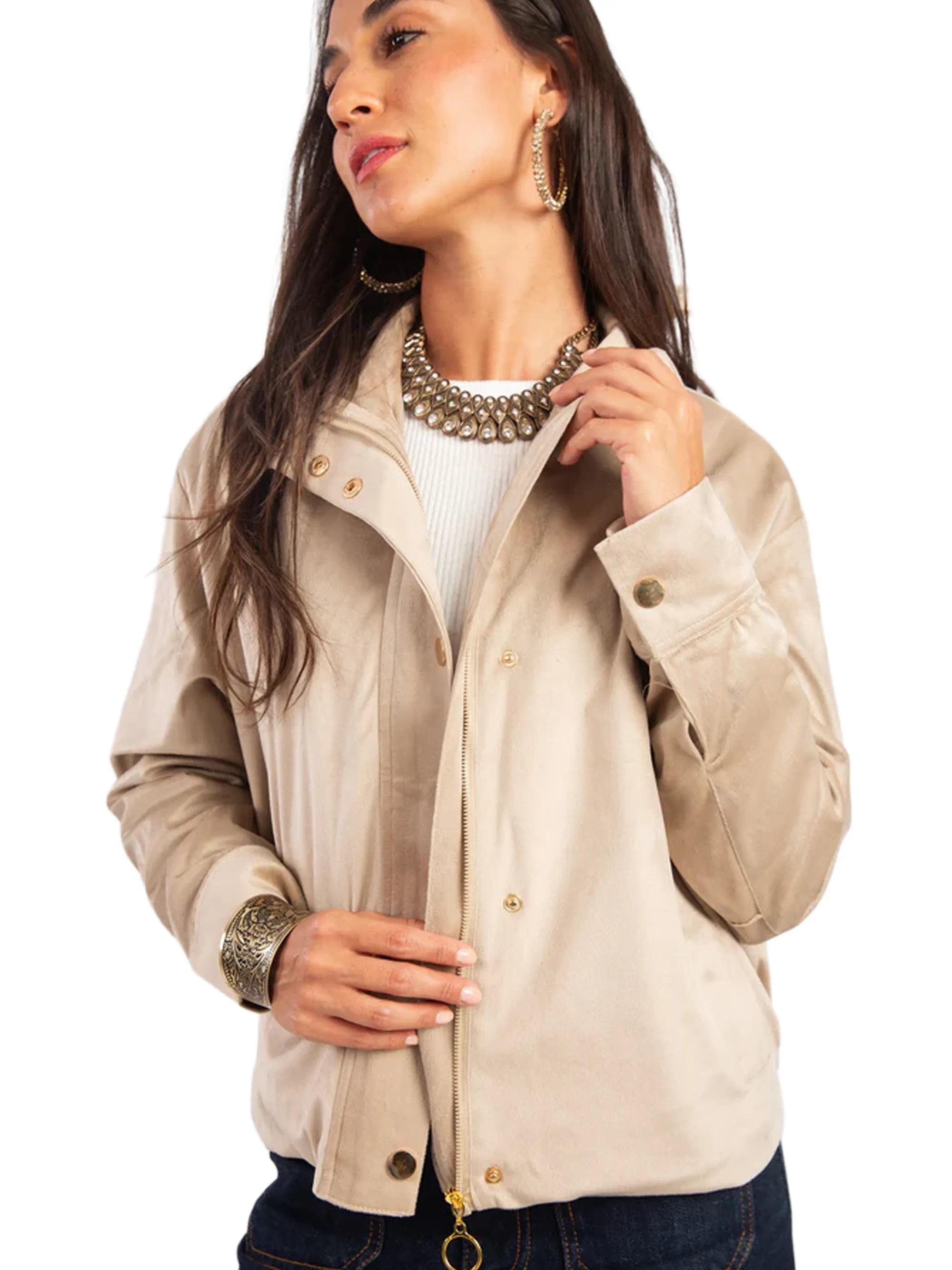 Woman wearing a beige jacket with a white background