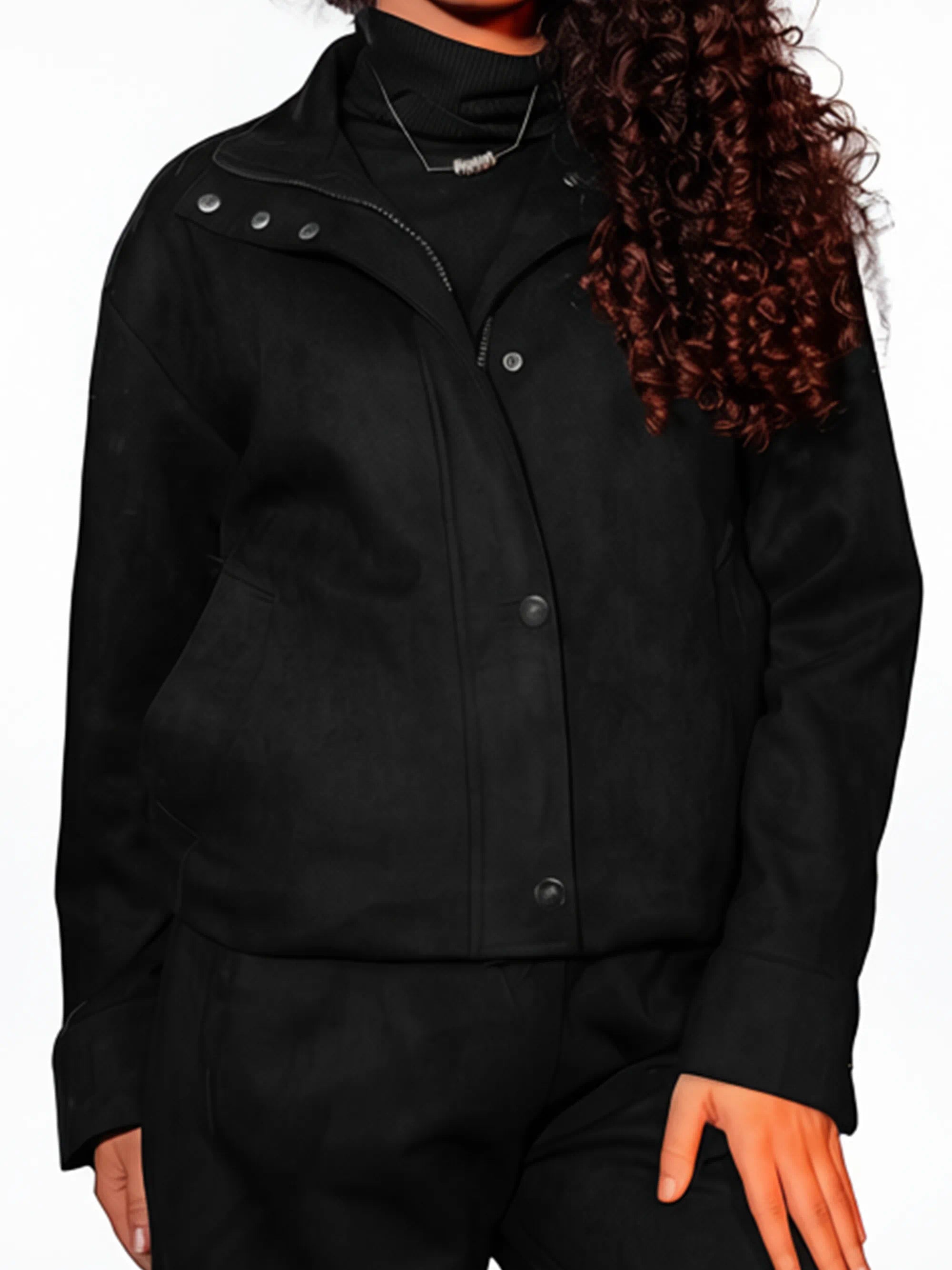 Person wearing a black jacket on a white background