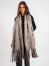 Woman wearing a gray scarf with star patterns and fringes on a white background