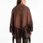 Brown fringed poncho worn by a person on a white background