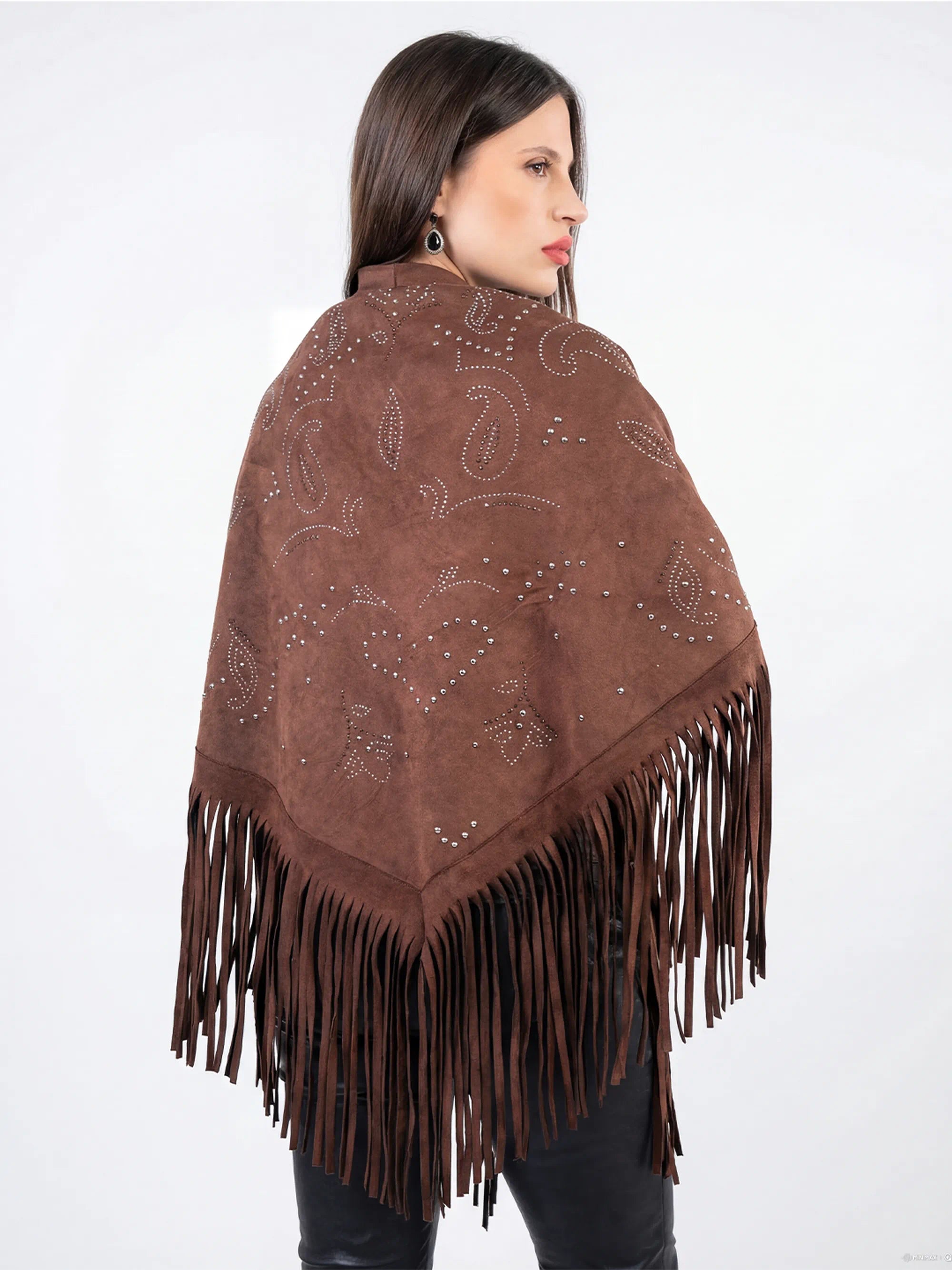 Woman wearing a brown fringed shawl with intricate patterns on a white background
